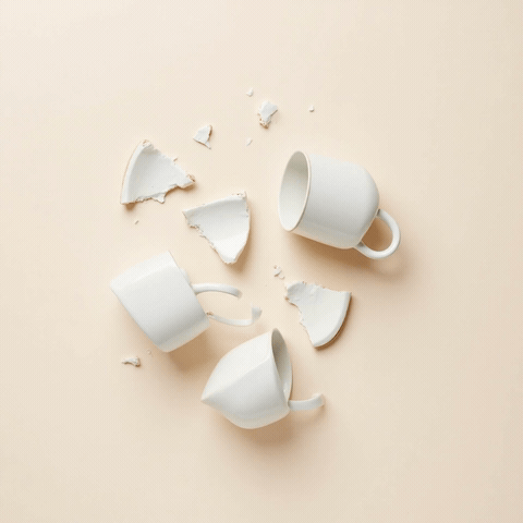Broken mug pieces snapping back together with Oops... Sorry! caption, animated funny sorry GIF