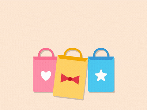 Treat yourself! It's your birthday ribbon over pink, yellow and blue paper-cut shopping bags swinging