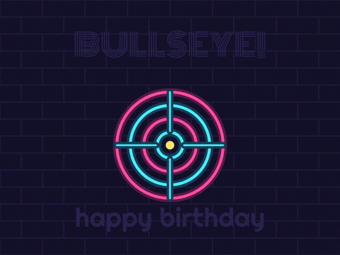 Happy birthday bullseye in pink and blue neon as a dart flies in and hits the centre of a neon dartboard