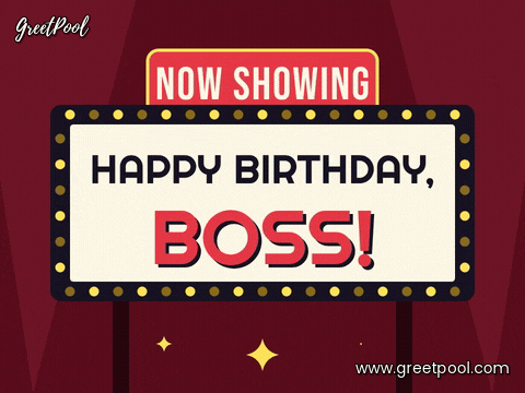 Now showing: Happy birthday, boss on a cinema marquee with chasing yellow bulbs and red curtains