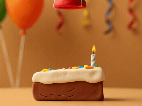 Party hat landing on a cake slice with confetti, happy birthday to an amazing friend gif