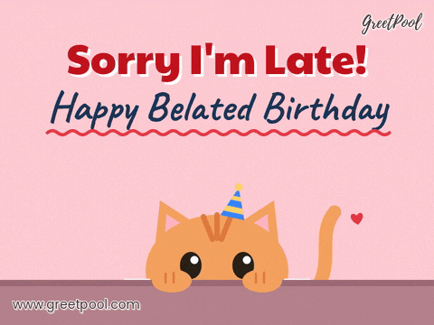Sorry I'm late happy belated birthday orange cat in a party hat peeking over a table edge
