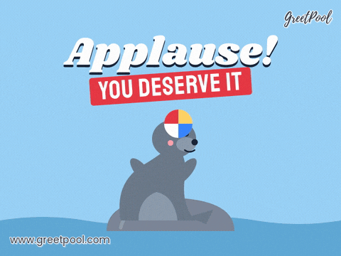 Applause Seal Celebration Applause celebration with a grey seal clapping its flippers while balancing a beach ball on its nose