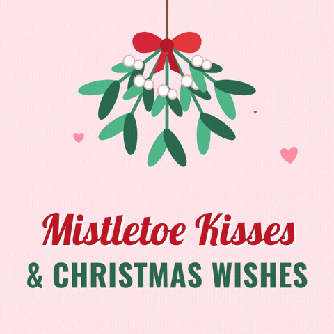 Mistletoe kisses and Christmas wishes with a swaying bunch of mistletoe, a red bow and floating hearts on pink