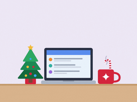 Out Of Office Merry Christmas Laptop Out of office Merry Christmas message as a laptop snaps shut on a desk and a Santa hat drops on top beside a mini tree