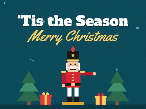 'Tis the season Merry Christmas nutcracker soldier waving and chomping between two pine trees and presents