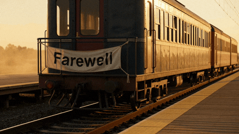 Farewell Banner Train Departing Platform Farewell banner on the back of a vintage train pulling away from a dusty platform in golden evening light