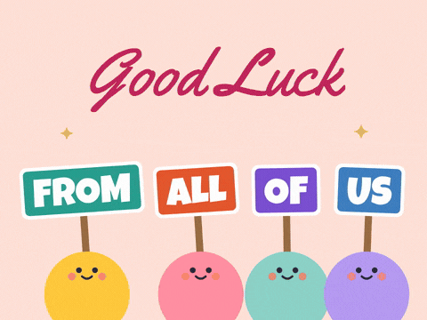 Good Luck From All Of Us Good luck from all of us, four cheerful colleagues holding up signs on a peach background