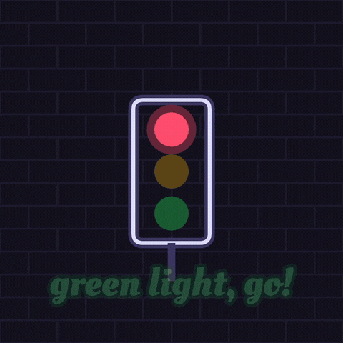 Good Luck Green Light Neon Good luck neon sign lighting up as a traffic light turns from red to amber to green, green light go