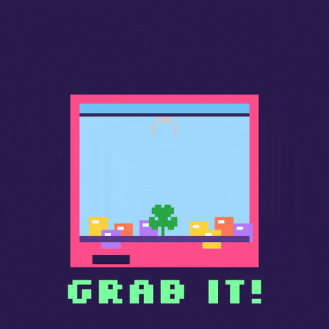 Good luck, grab it, in 8-bit letters as a pixel arcade claw machine grabs a green four leaf clover prize