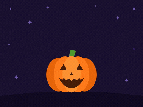 Spooky Halloween Jack O Lantern Glow Have a spooky Halloween jack-o-lantern pumpkin lighting up with a glowing yellow grin on a dark night
