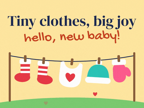 Tiny clothes, big joy new baby message with baby socks, a bib, a hat and a mitten on a clothesline