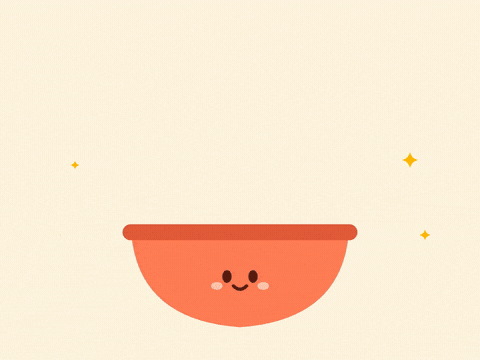 Happy New Year, 12 grapes, 12 wishes, purple grapes dropping one by one into a smiling orange bowl