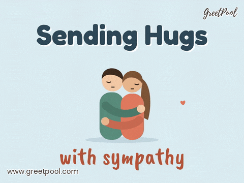 Sending hugs with sympathy, two friends holding each other in a gentle condolence hug