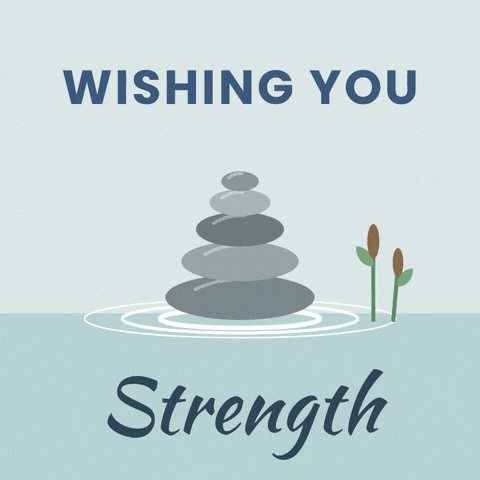 Wishing you strength sympathy stack of balanced stones with ripples spreading across still water