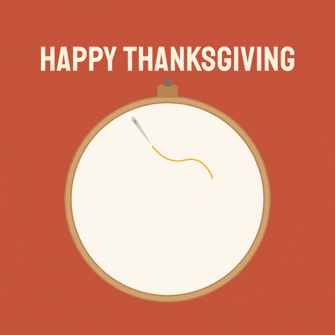 Happy Thanksgiving, an embroidery hoop cross-stitches a red heart and the word thankful one stitch at a time