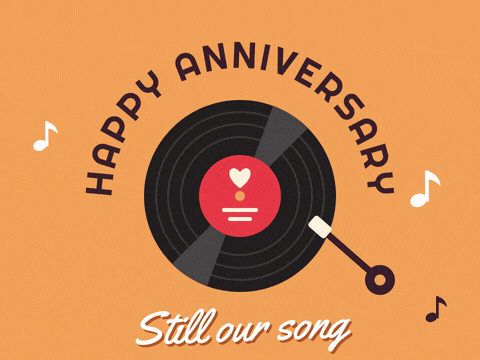 Happy anniversary curved over a spinning vinyl record with a heart label and a Still our song message