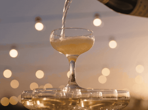 Champagne coupe tower pouring with Cheers To The Happy Couple message, animated wedding GIF