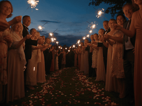 Sparkler Send Off Lifetime Of Love Wedding Guests holding sparklers for a send-off with Wishing You A Lifetime Of Love message, animated wedding GIF