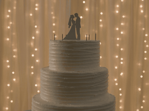 Tiered Wedding Cake Congratulations Tiered white wedding cake with a topper and sparklers and a Congratulations message, animated wedding GIF
