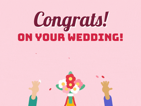 Congrats on your wedding with hands reaching up to catch a tossed bouquet of red and white flowers on pink