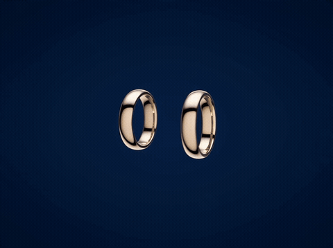 Wedding Rings Infinity Heres To Forever Two wedding rings forming an infinity symbol in golden light with Here’s To Forever message, animated wedding GIF