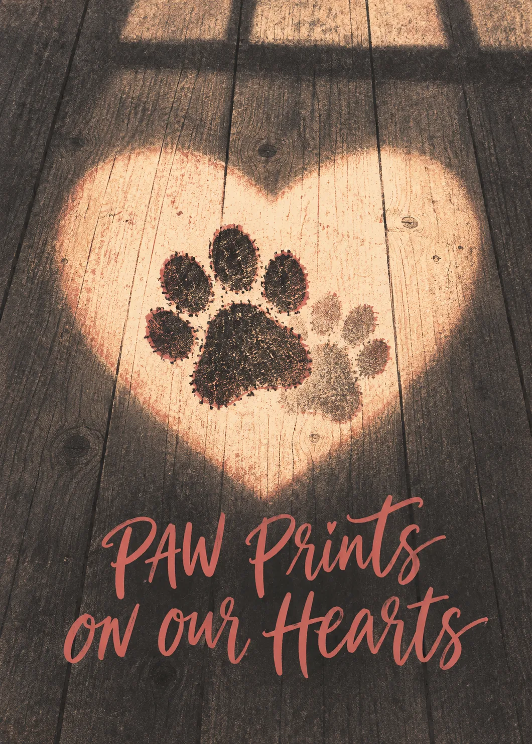 Glowing heart of light on wood floor holding a paw print with text paw prints on our hearts