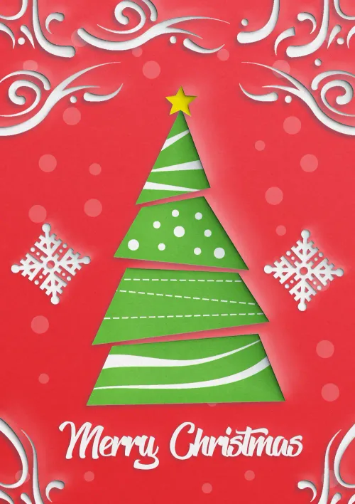 Paper cutout style Christmas tree and snowflakes on a red background